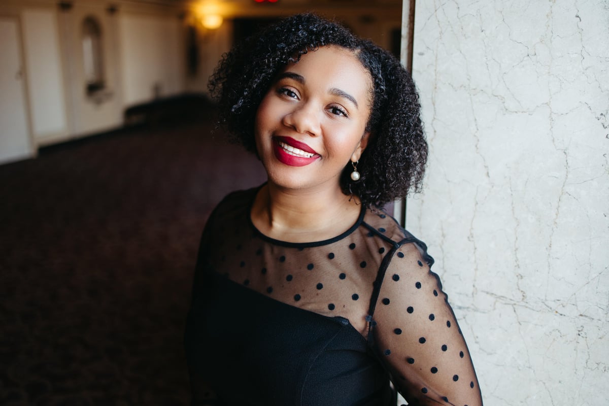 Professional musician headshot featuring a close-up image with natural lighting, showcasing personality and expression.