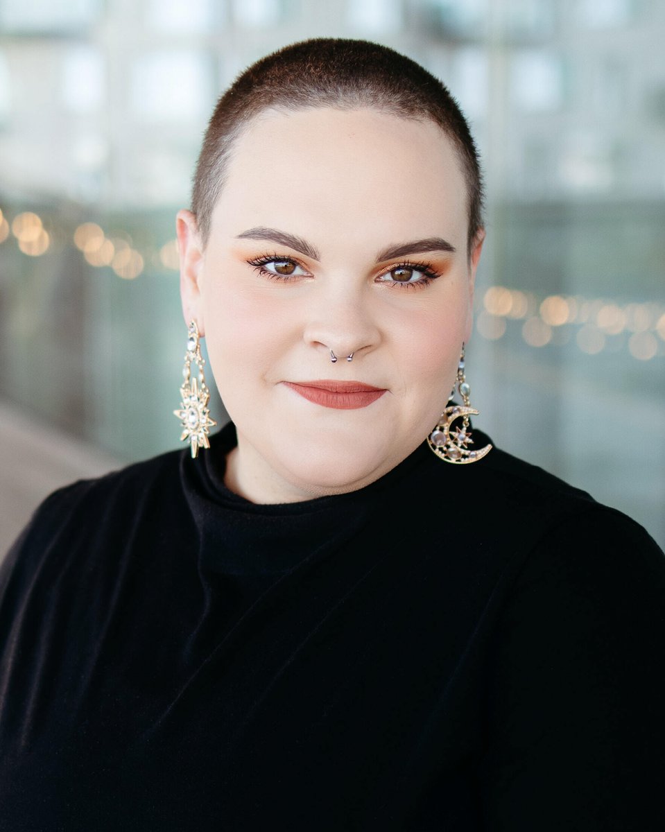 Professional musician headshot of a mezzo soprano featuring a close-up image with natural lighting, showcasing personality and expression.